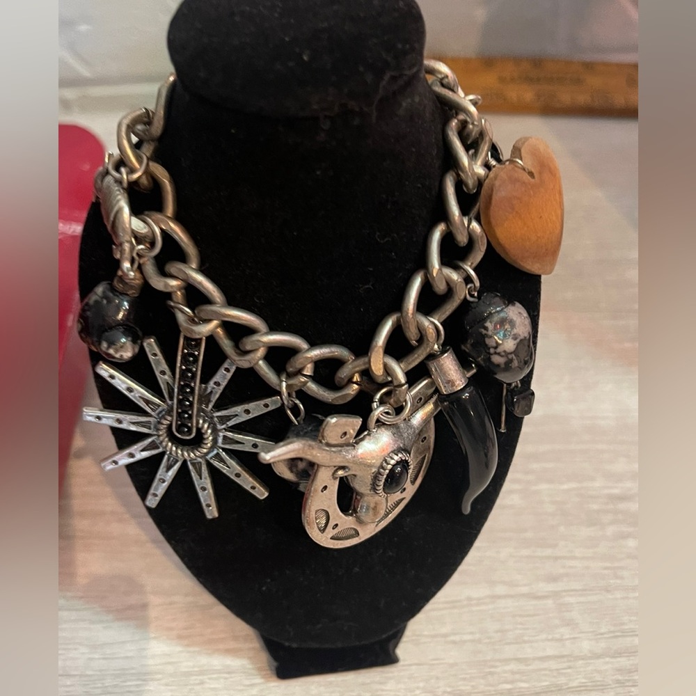 Heavy western themed silver tone charm bracelet.